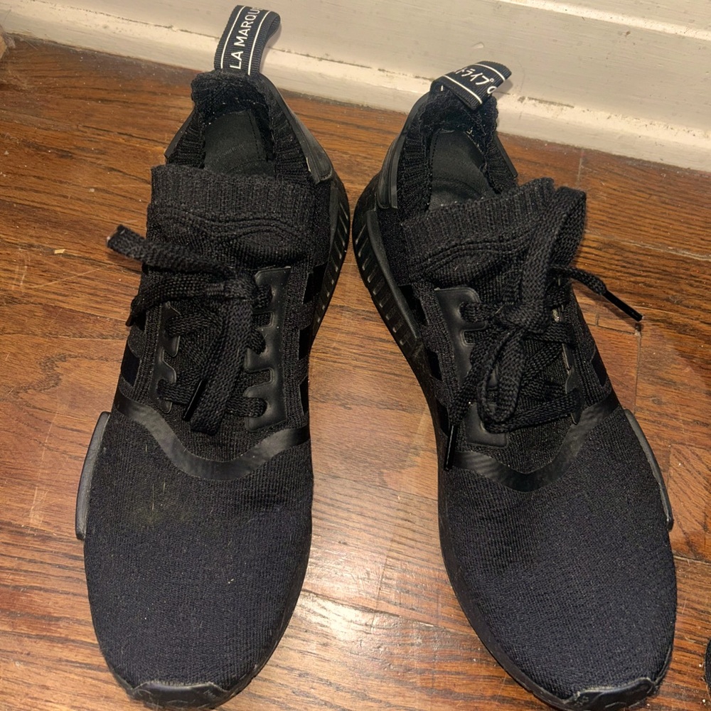 Adidas La Marque Aux 3 Bandes size 10 men’s shoe. In the color black.